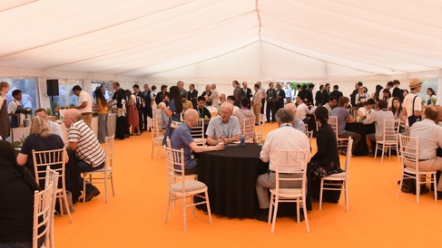 Attendees at the CGC and EE Anniversary Event 2026 mingle and chat.