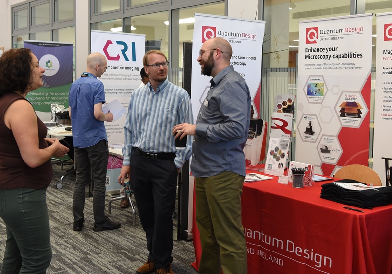 Exhibitors talk to attendees at the CGC and EE Anniversary Event 2026